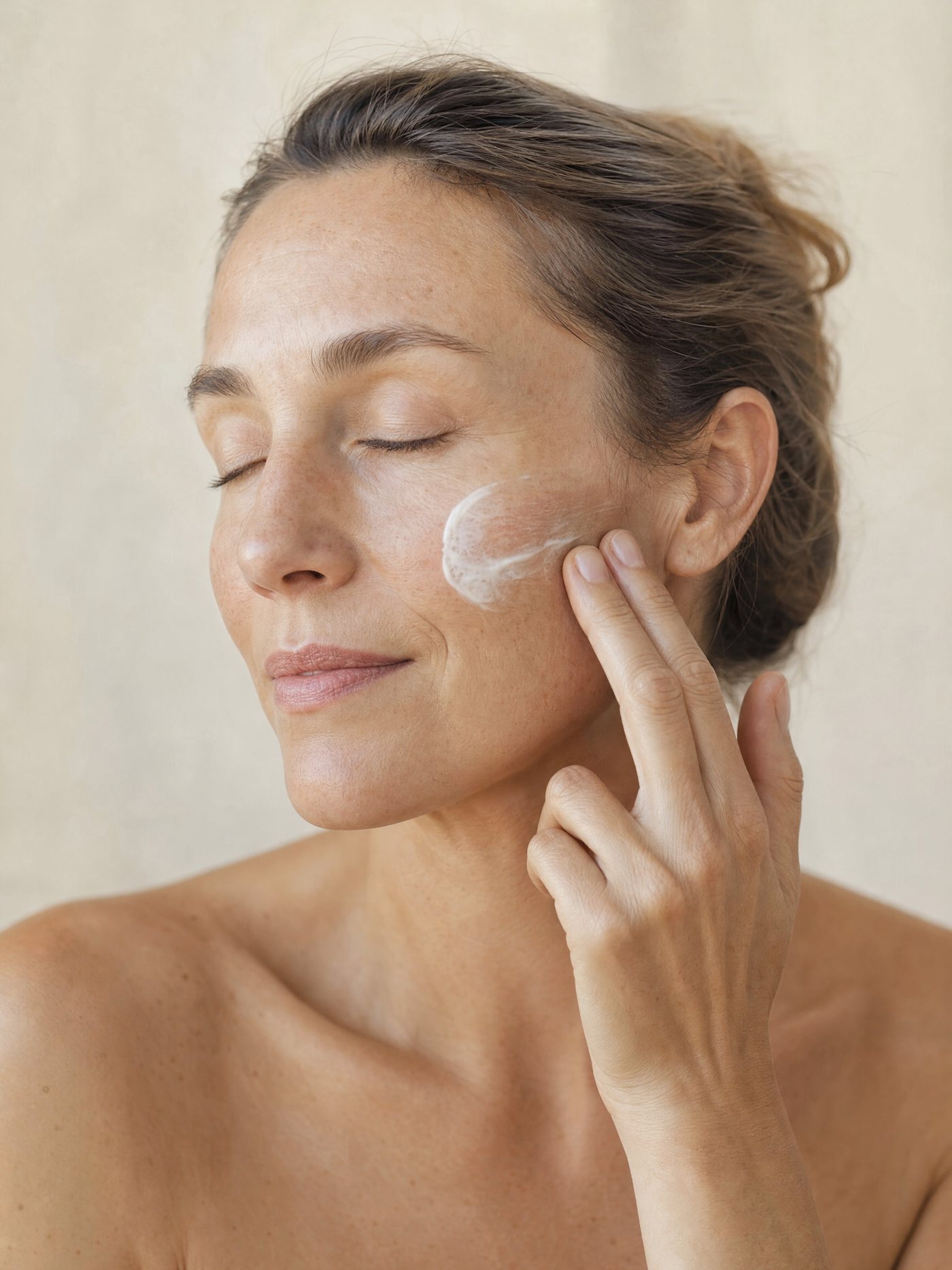 Applying OzoMD Ozonated Face Cream to the cheek