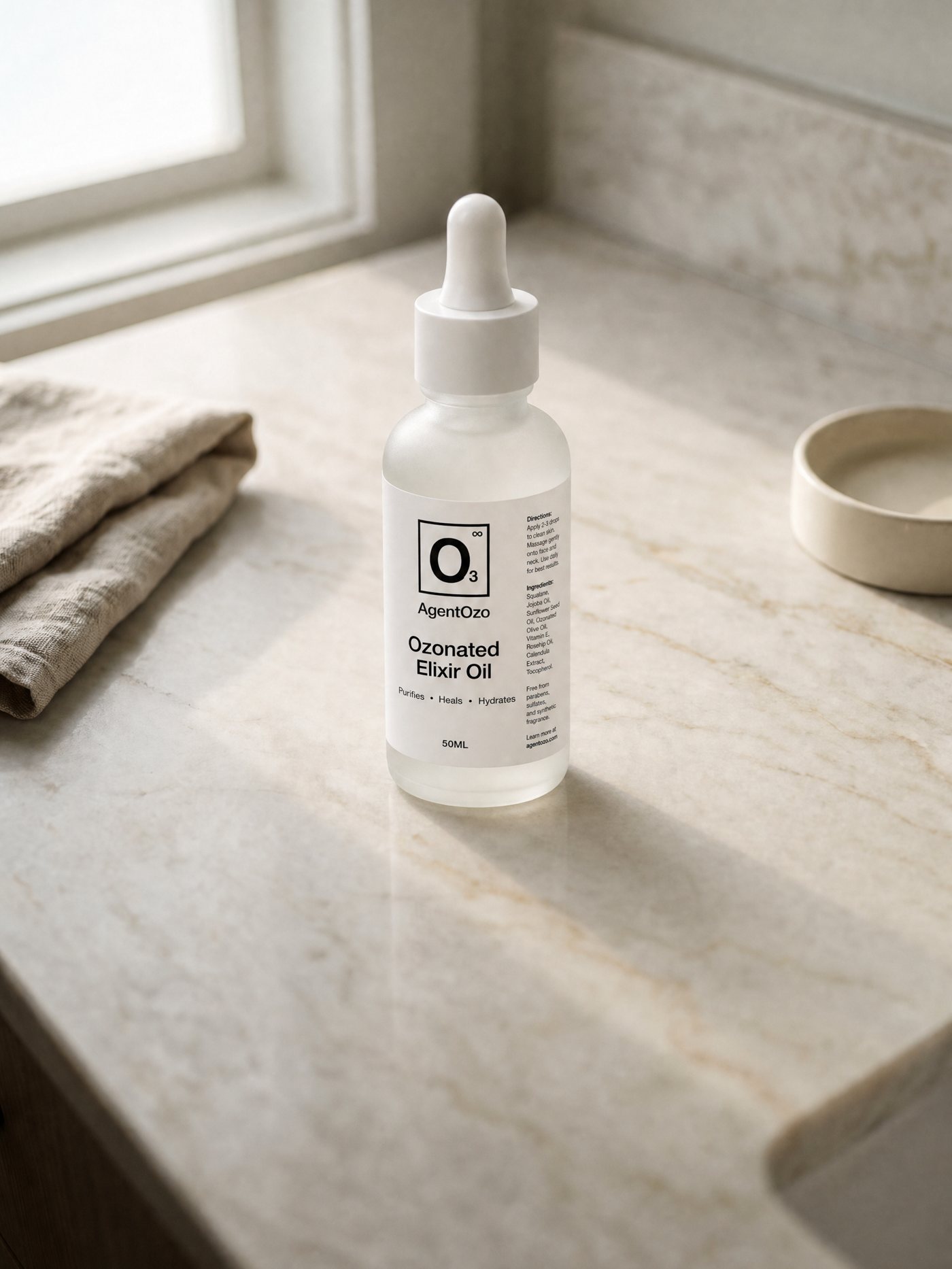OzoMD Ozonated Elixir Oil standing on a marble bathroom counter in morning light